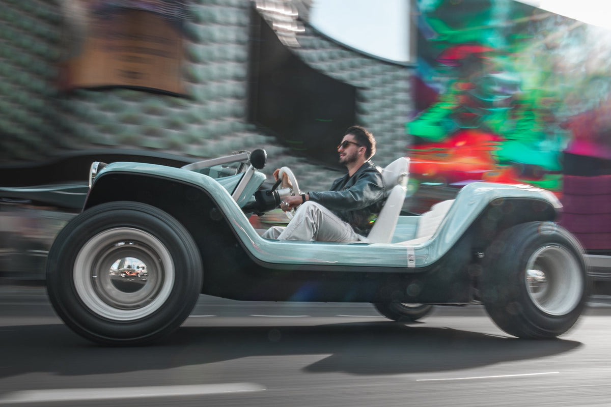 Meyers Manx Resorter NEV driving through the city